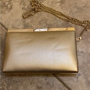 Scarlett gold clutch handbag with gold shoulder accent chain